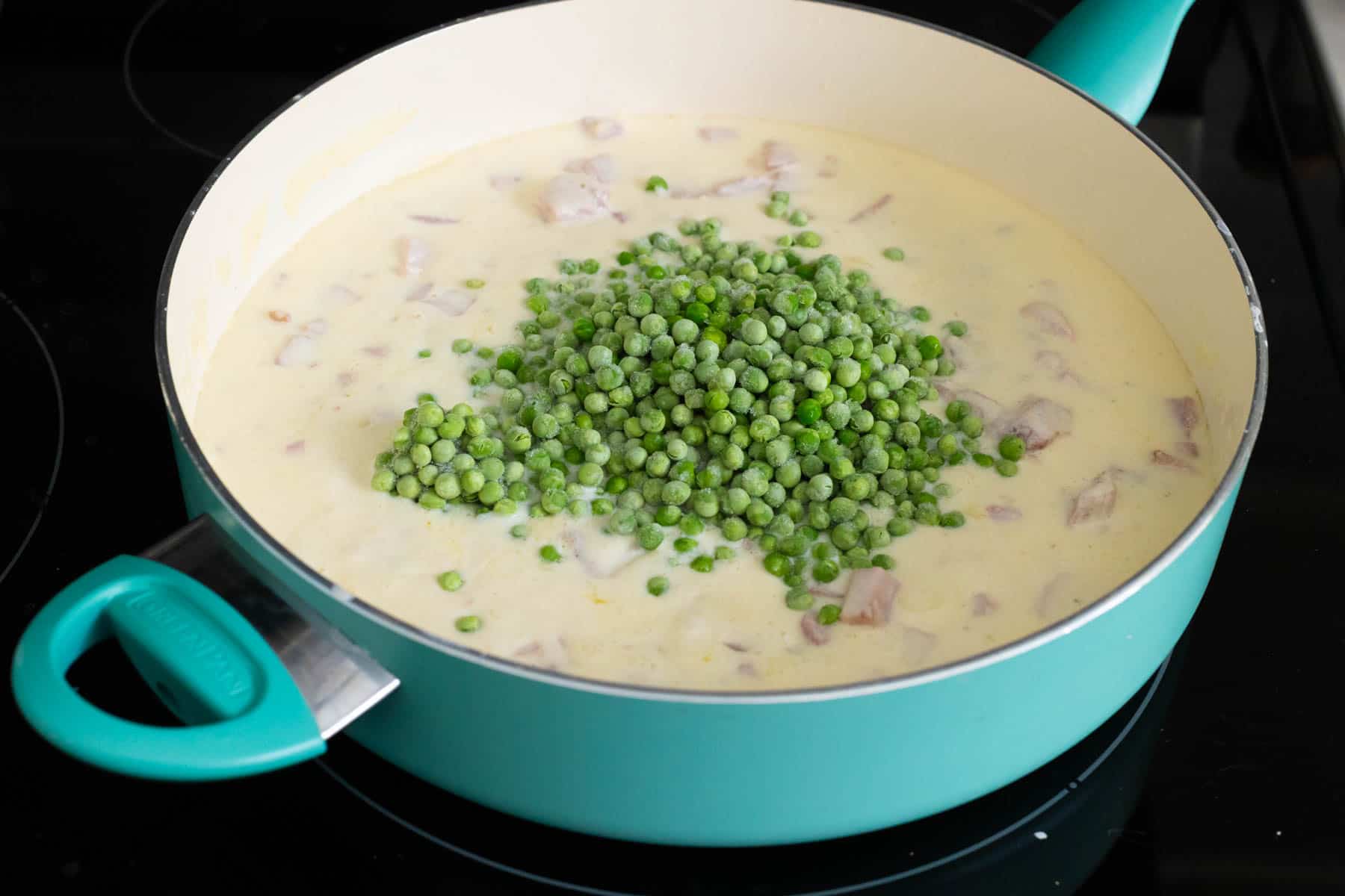The peas have been added to the sauce.
