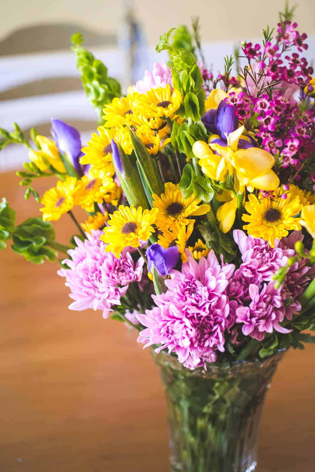 The bouquet from Trader Joe's is in a vase.