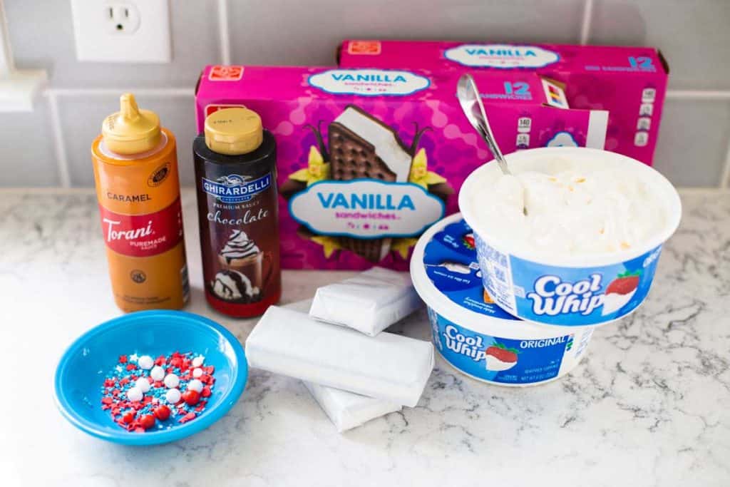 The ingredients for the ice cream sandwich cake sit on a kitchen counter.