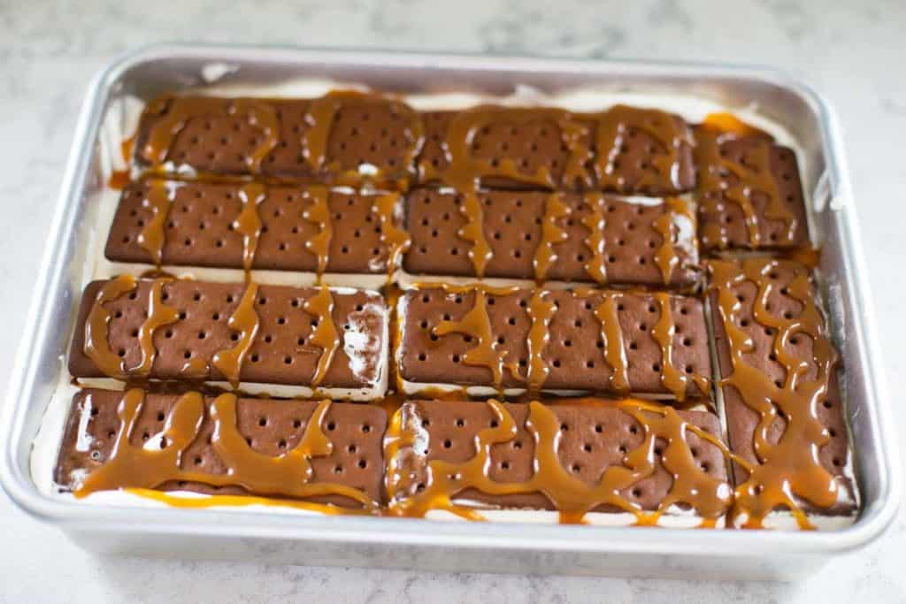 Step 3: More ice cream sandwiches have now been drizzled with caramel.