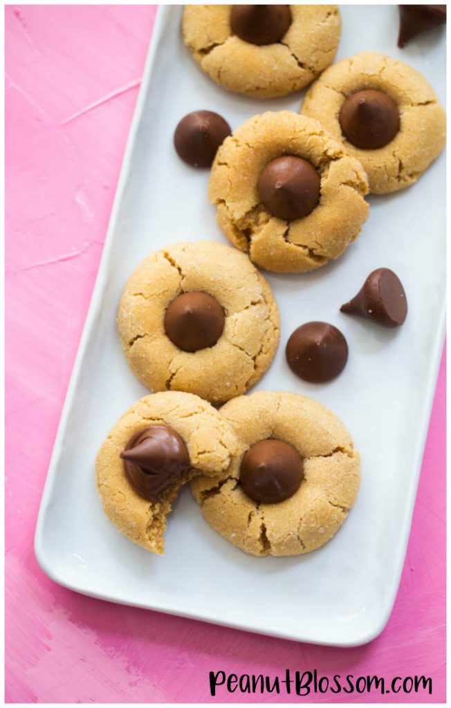 Everything you ever needed to know about baking peanut butter blossoms: the best peanut butter and Hershey kiss cookie ever.