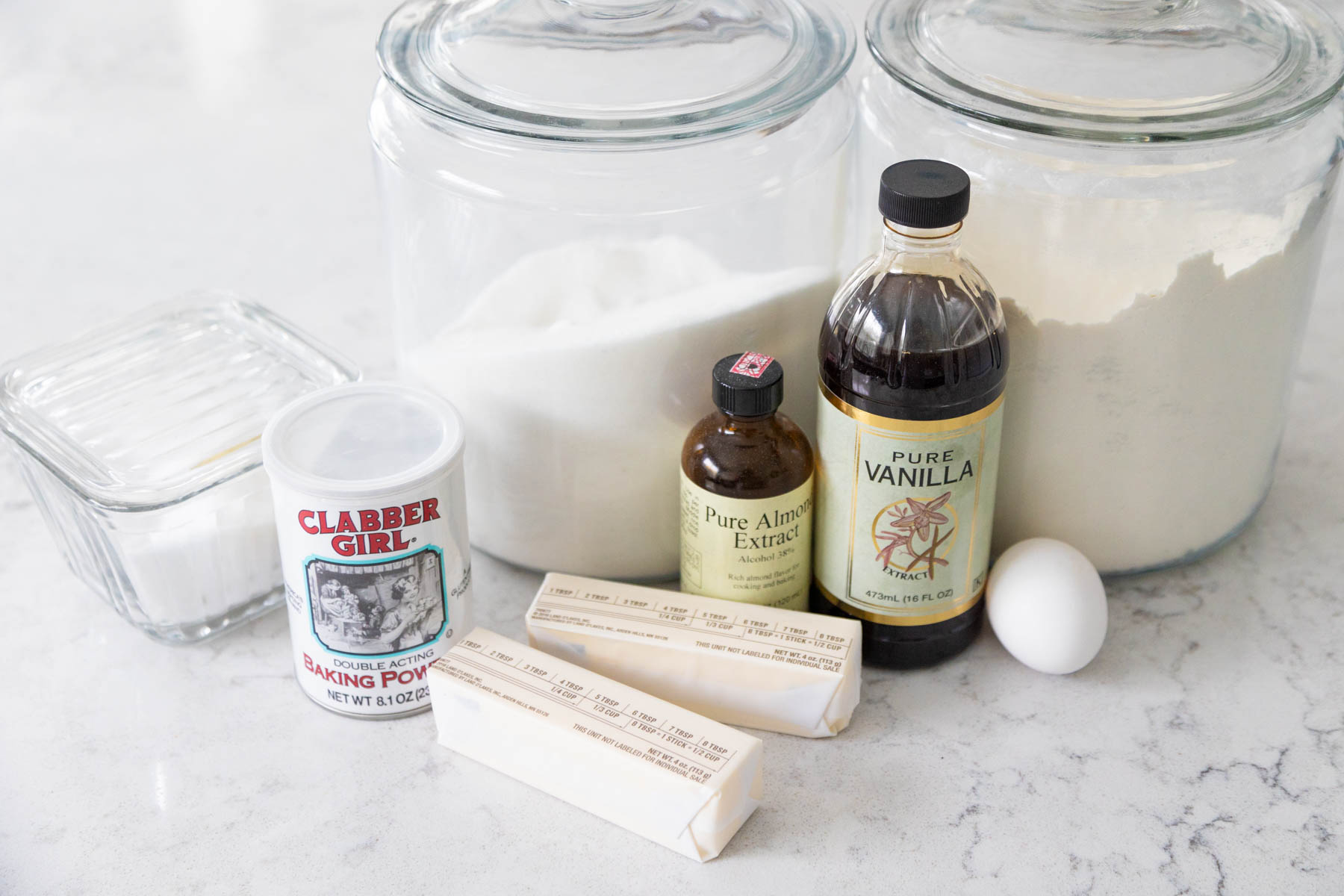 The ingredients to make cut out sugar cookies are on the kitchen counter.