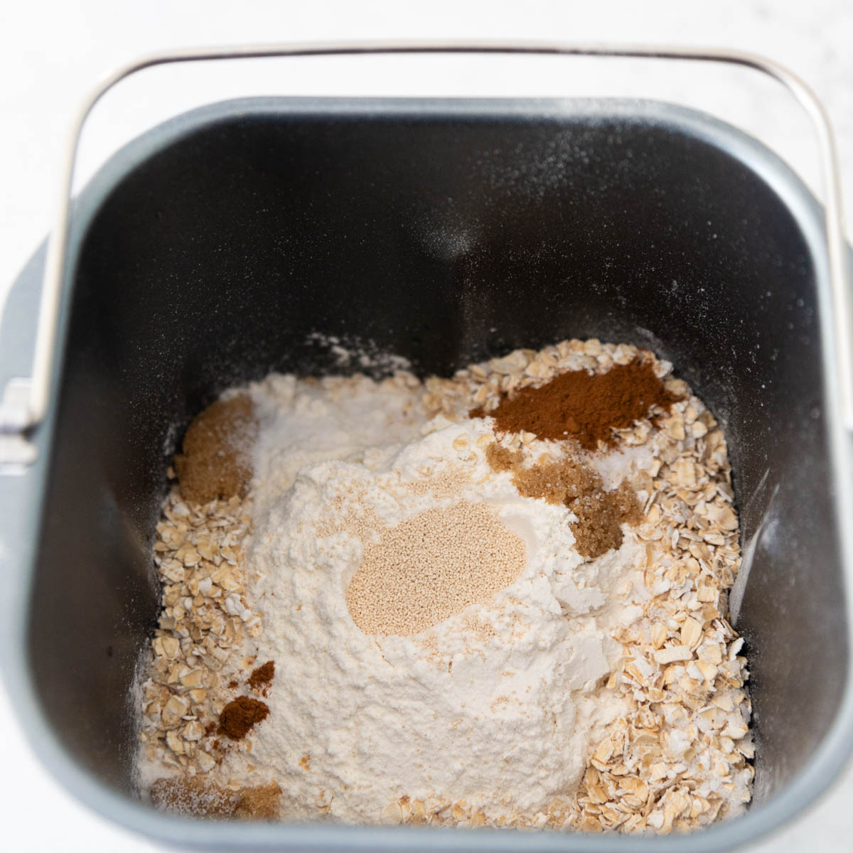 The dry ingredients have been added to the bread pan.