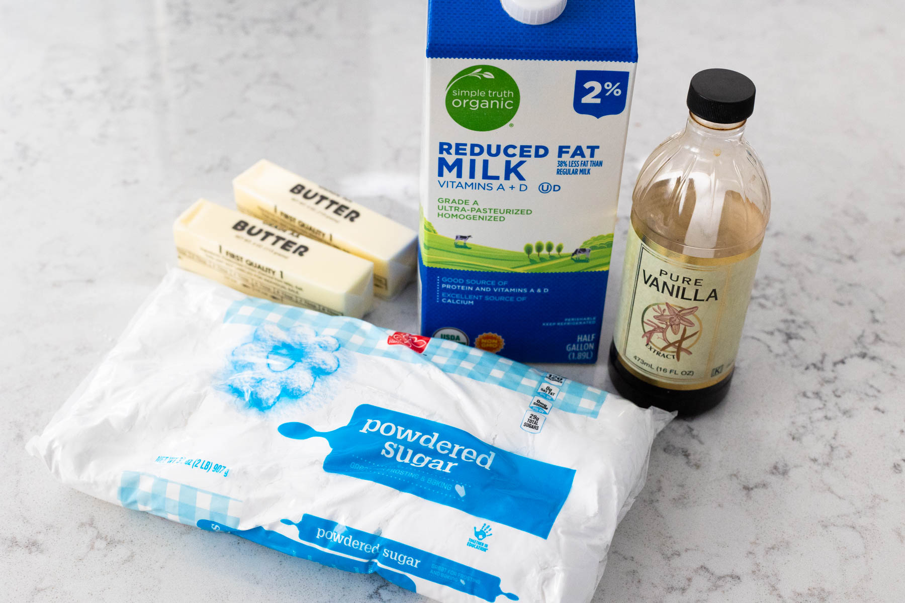 The ingredients to make browned butter frosting are on the counter.