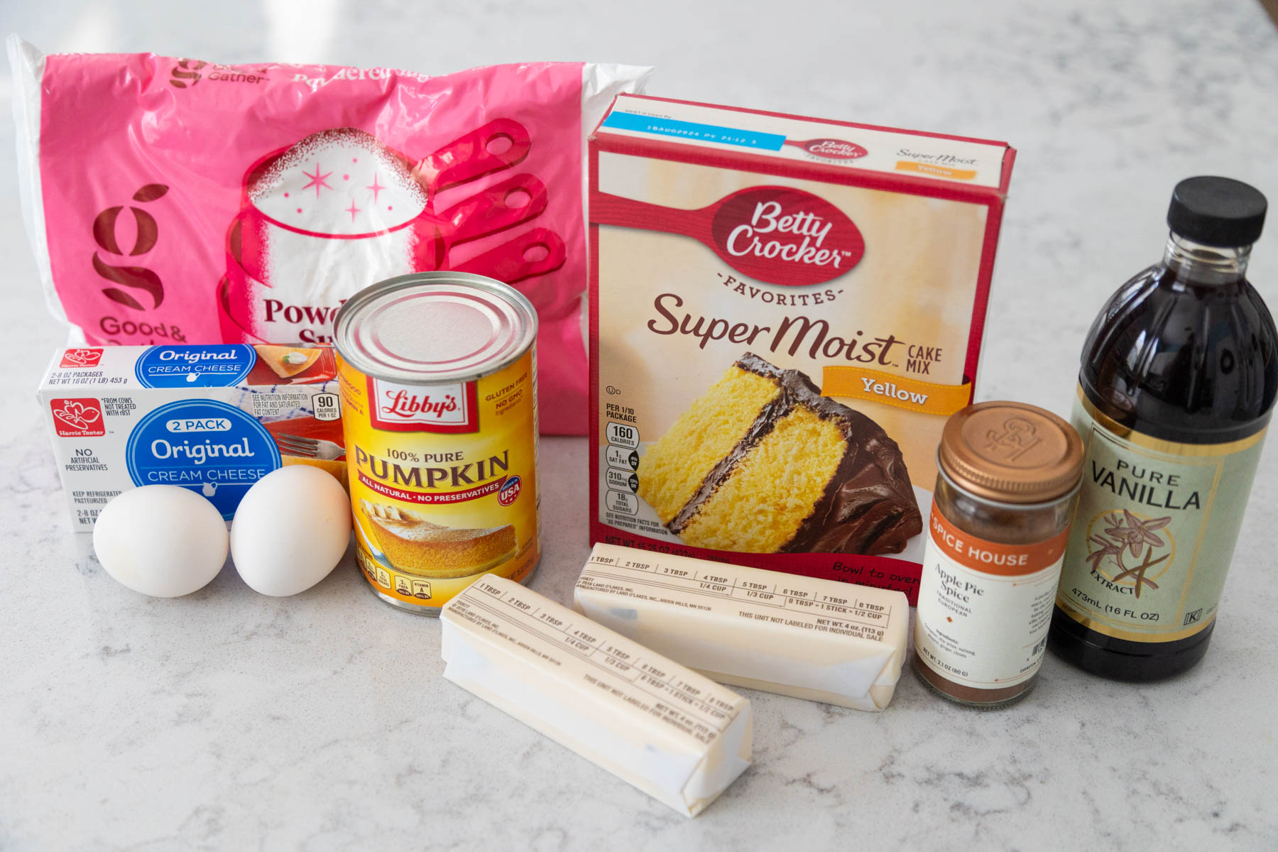 The ingredients to make the gooey butter cake are on the counter.