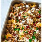 The chex mix in a 9x13-in baking dish.