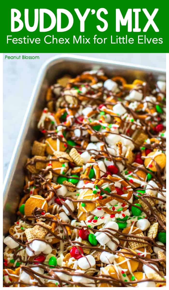 Buddy's Mix: Festive Christmas Chex Mix for Little Elves. Maple-coated Chex cereal is topped with white chooclate drizzled pretzles, marshmallows, red & green candies, Nila wafers, and a finished with a chocolate drizzle over the top.