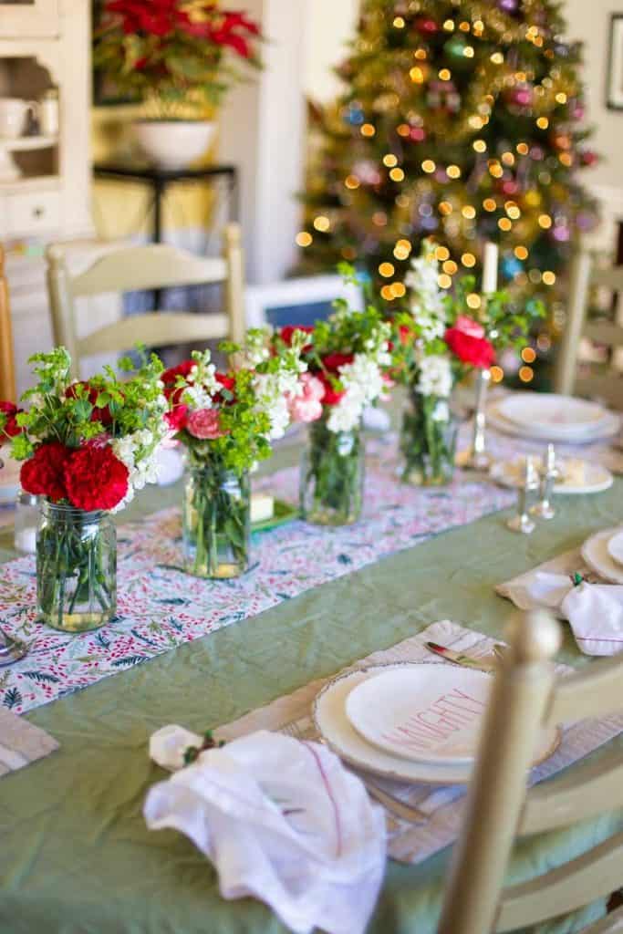 A beautiful Christmas dinner doesn't have to be complicated. This table with fresh flowers in mason jars can be set in minutes.