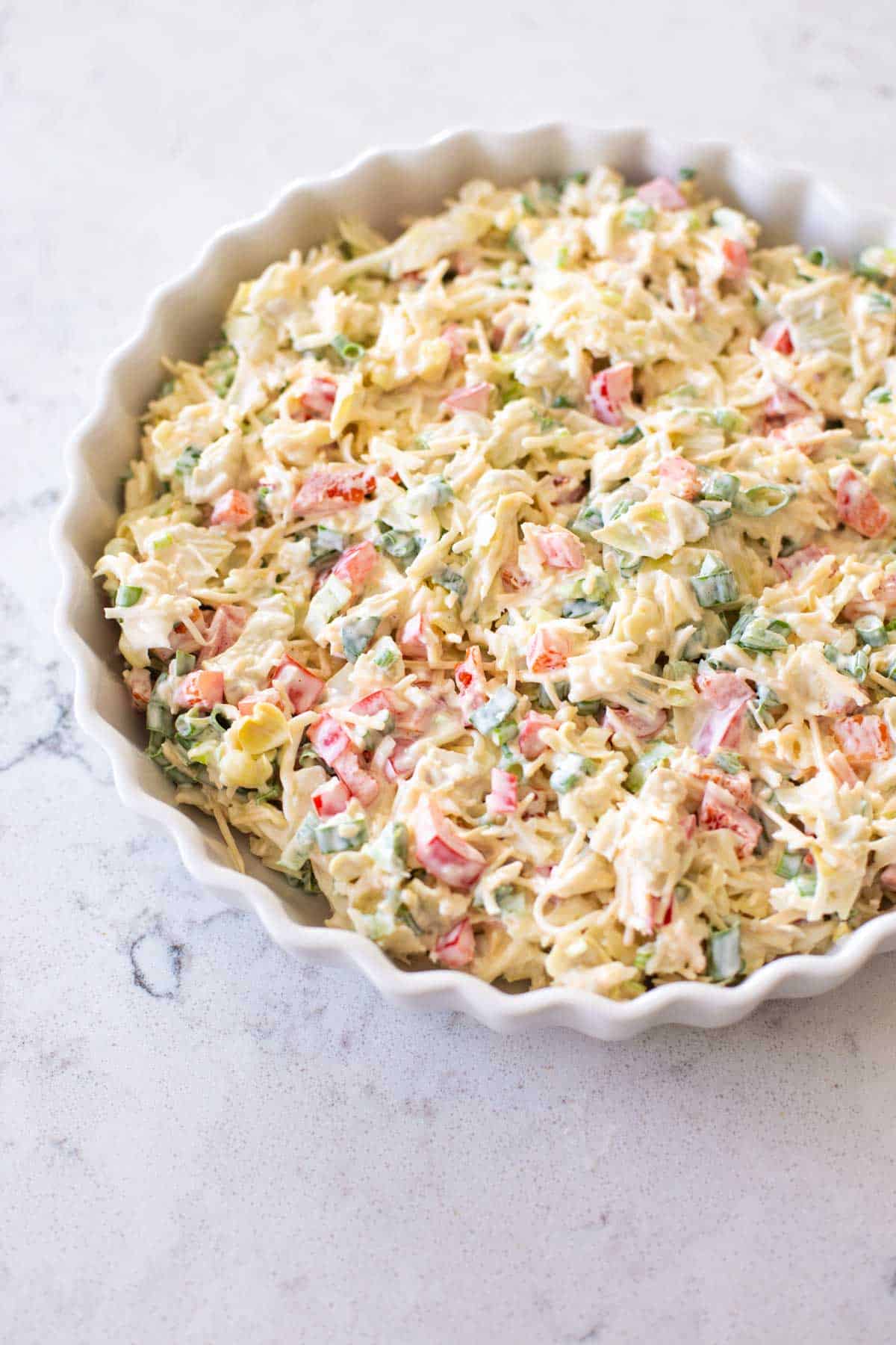 The dip has been prepared and added to a baking dish.