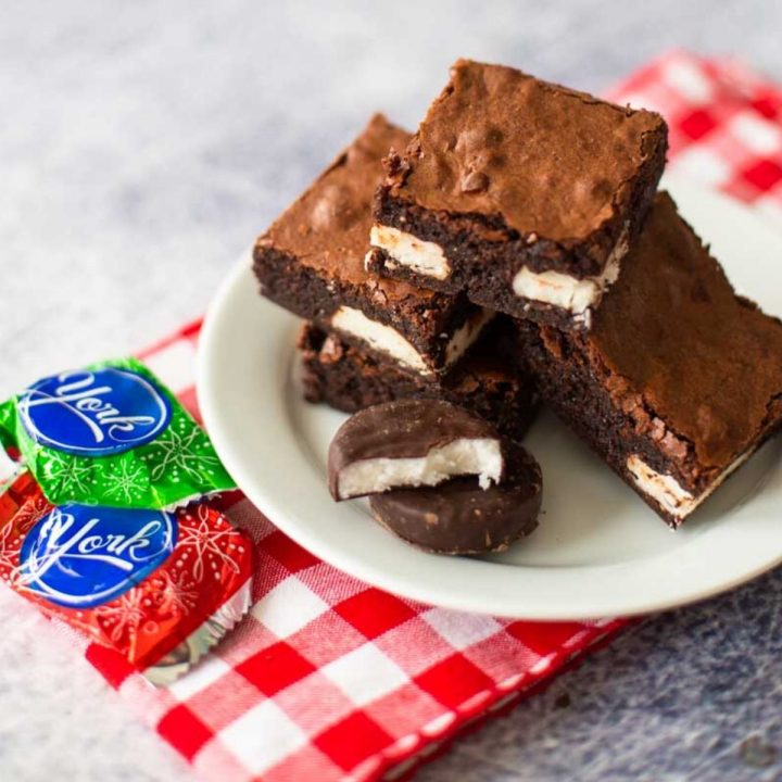 A platter of peppermint brownies has York candies next to it.
