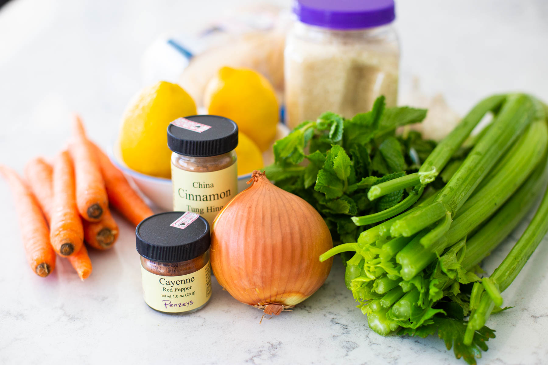The ingredients to make the homemade chicken soup are on the counter.