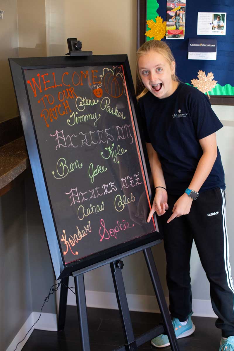 Welcome to Hull & Coleman Orthodontists: Our girl's name is finally on the Braces Off Day sign.