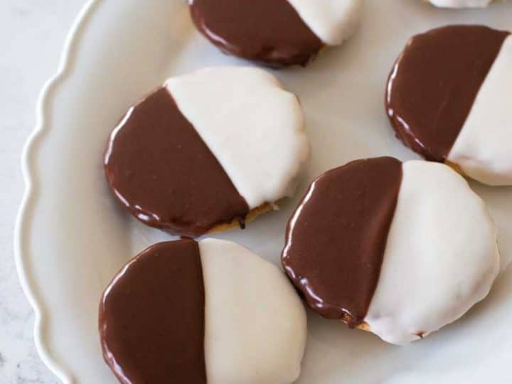 A serving platter filled with black and white cookies.