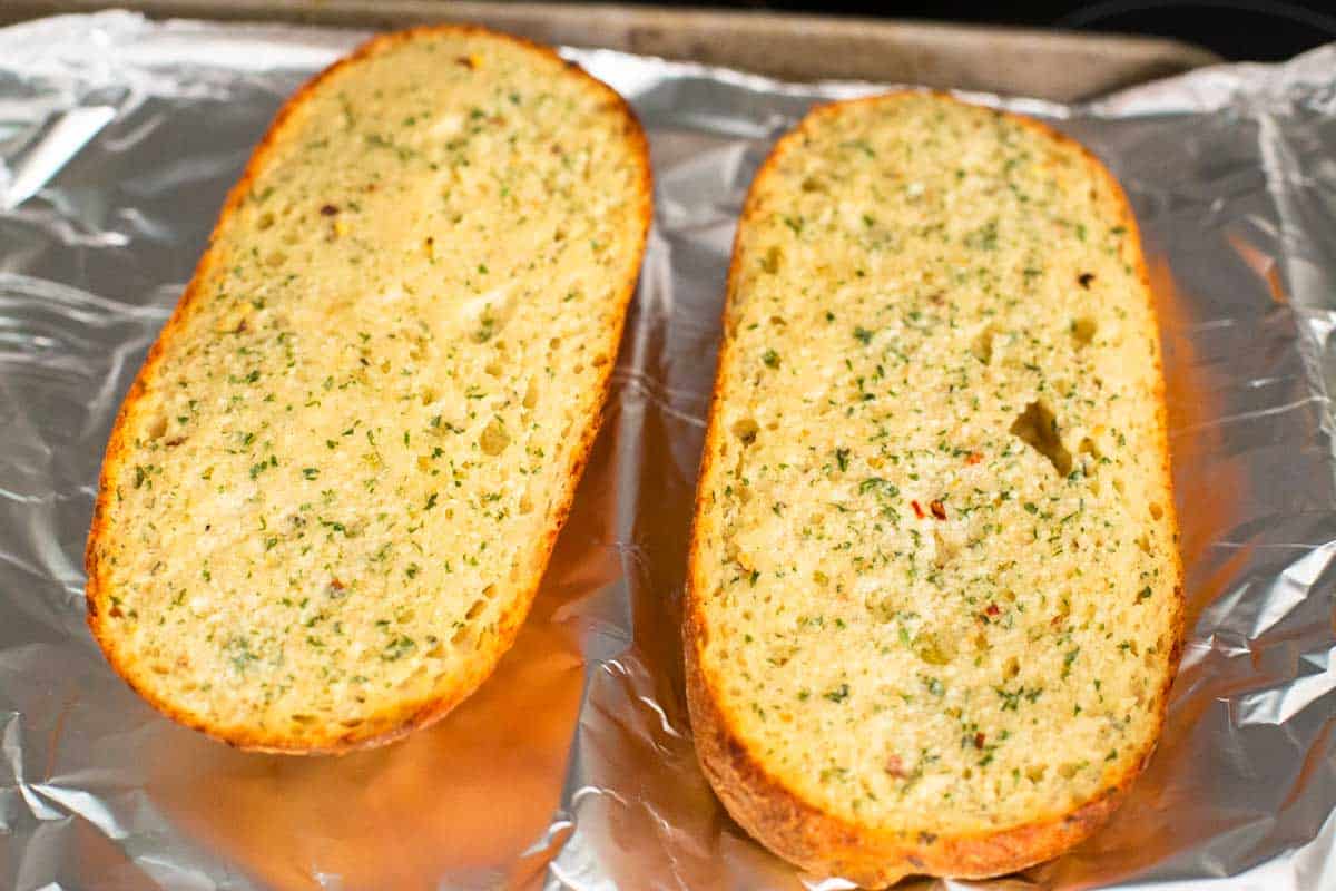 The halves of bread have been baked in the oven and are golden brown.