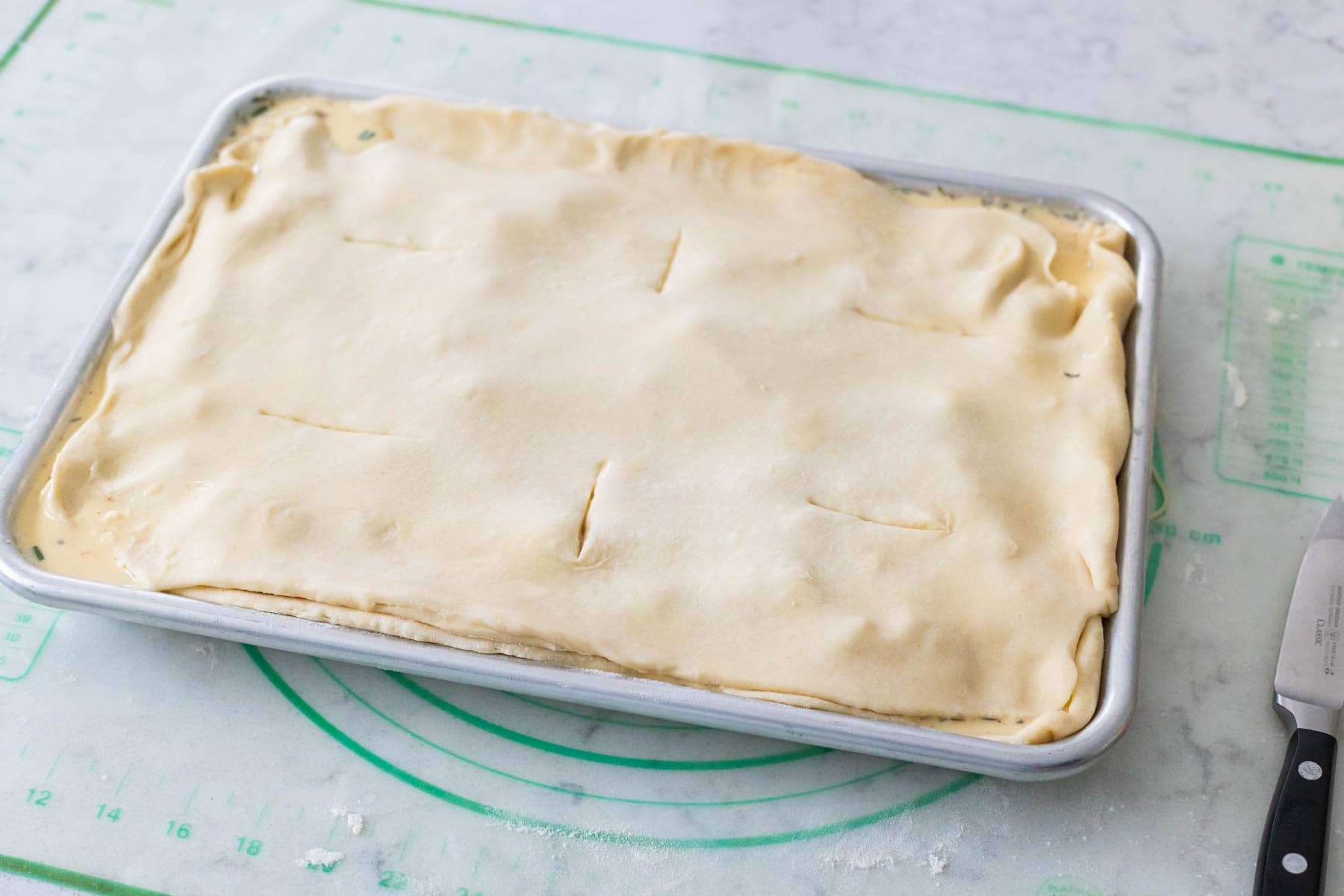 The top crust has been place on top of the pie.
