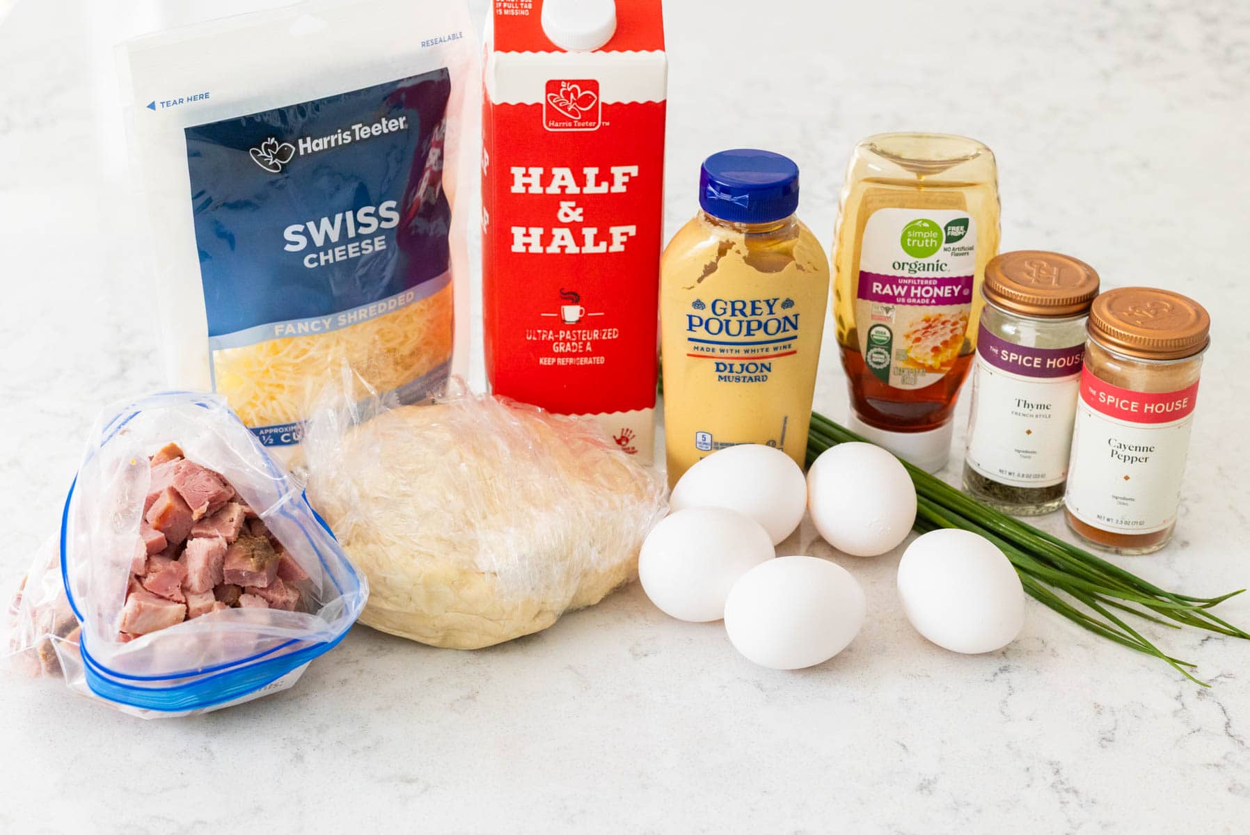 The pie crust and ingredients to finish the ham and egg pie are on the counter