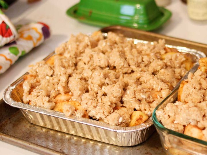 A freezer-friendly metal pan holds an 8x8-inch apple crisp with crumble topping.