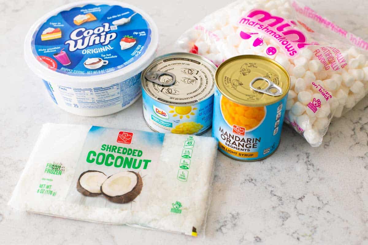 The ingredients to make pineapple ambrosia are on the counter.