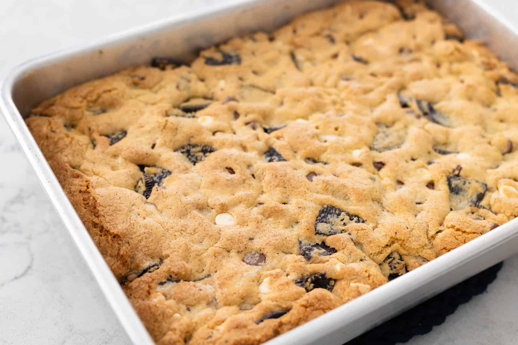 The finished OREO cookie bars are fresh from the oven and golden brown.