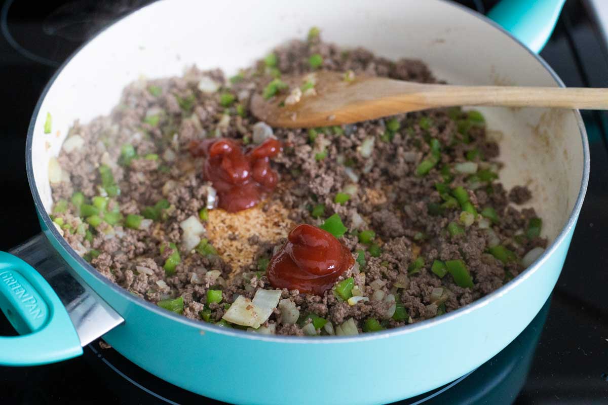 There are two dollops of ketchup on top of the beef mixture.