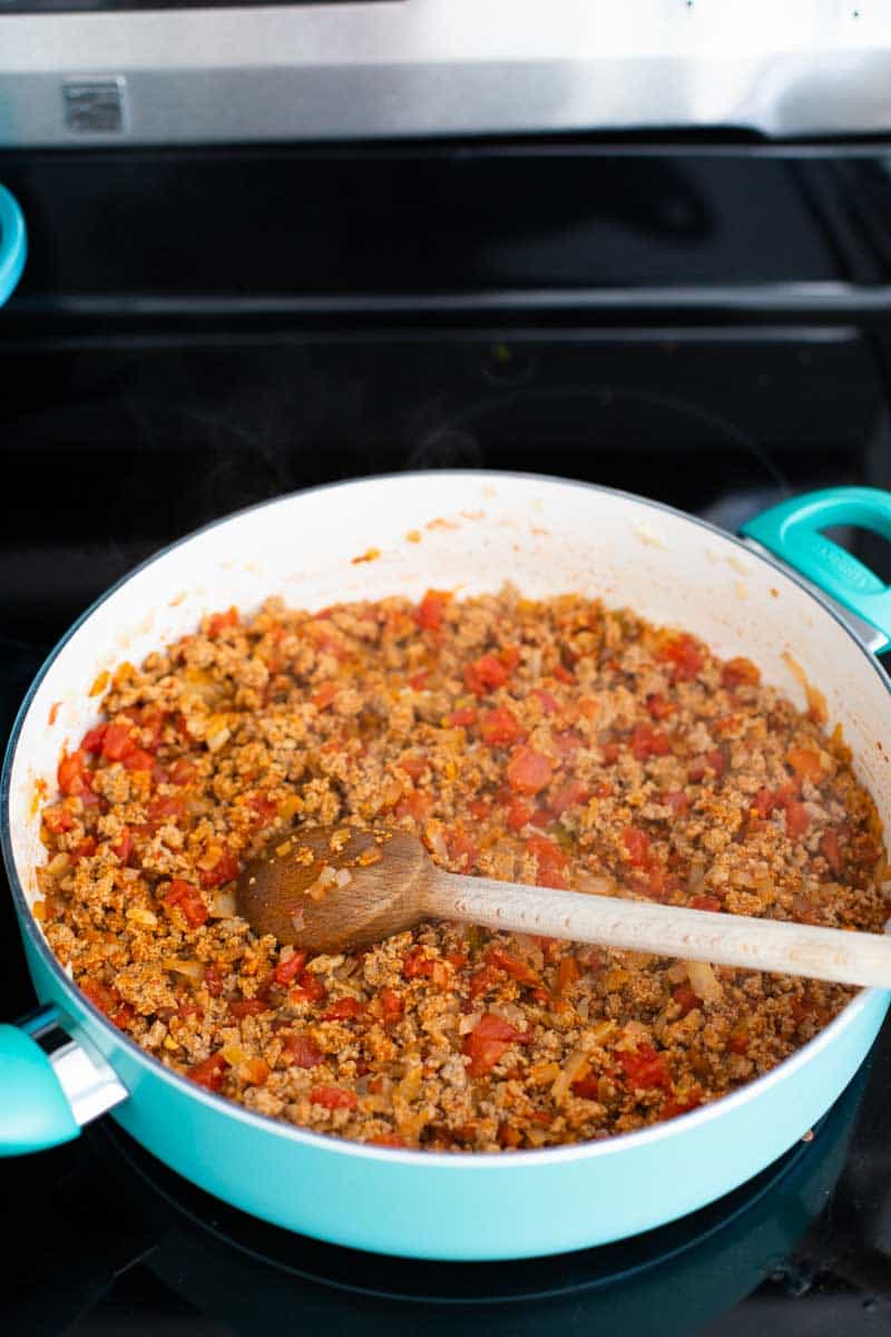 The ground turkey has been cooked in a large skillet.