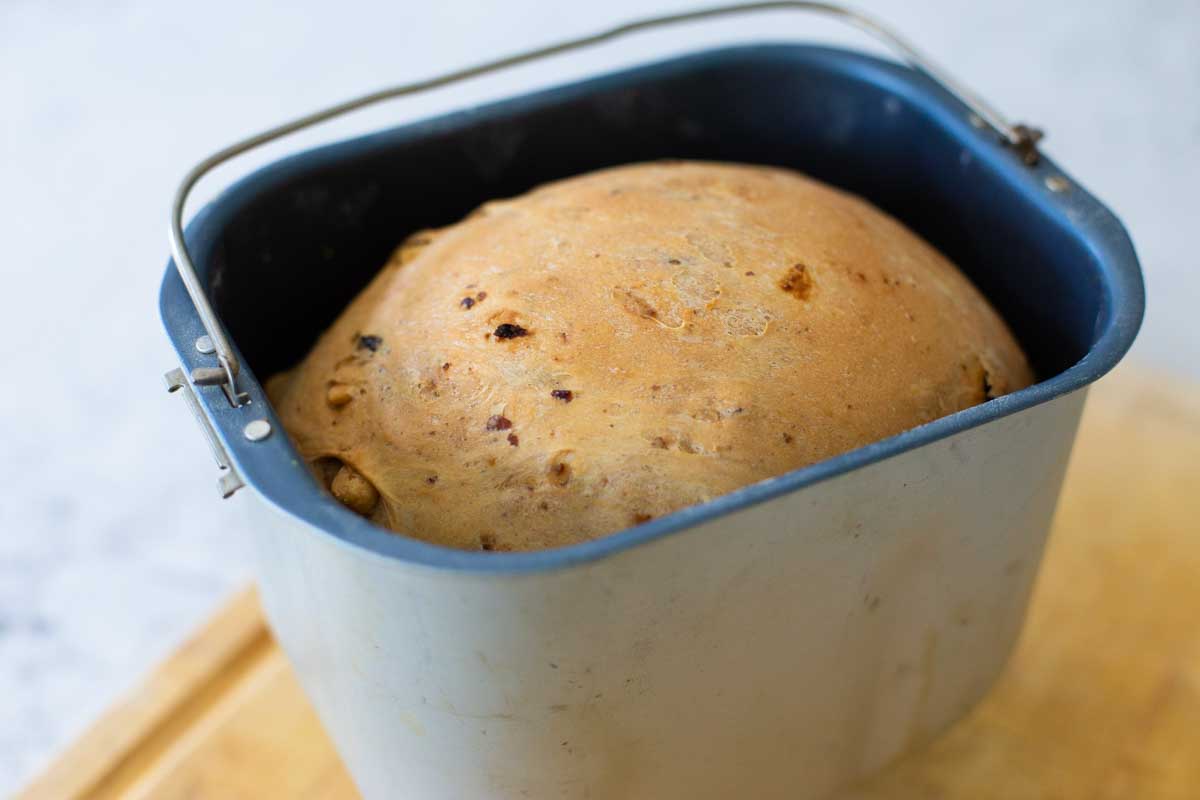 The fresh baked bread is still sitting in the bread machine pan.