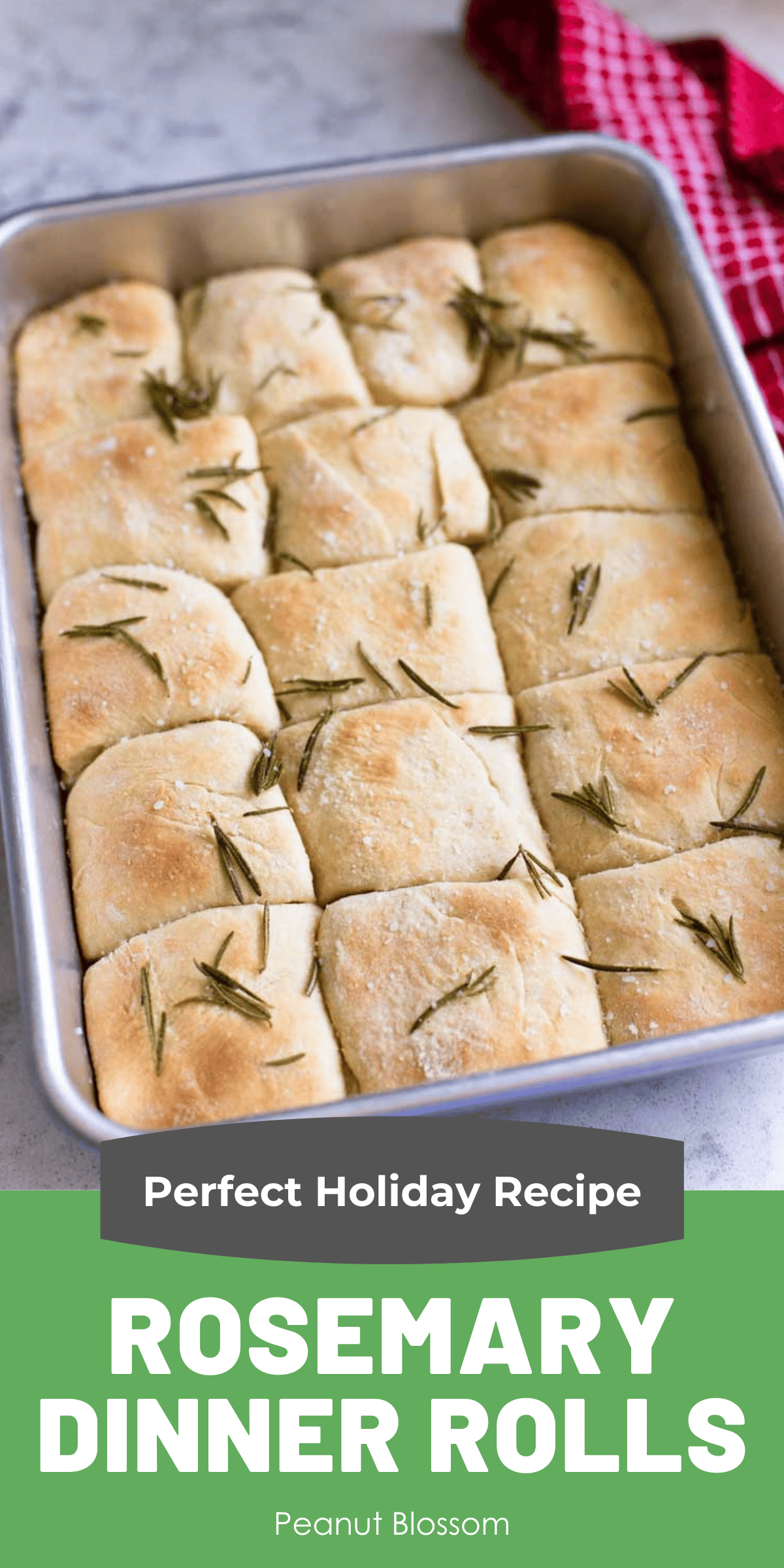 Finished baking pan of buttery dinner rolls with bits of fresh rosemary sprinkled over the top.