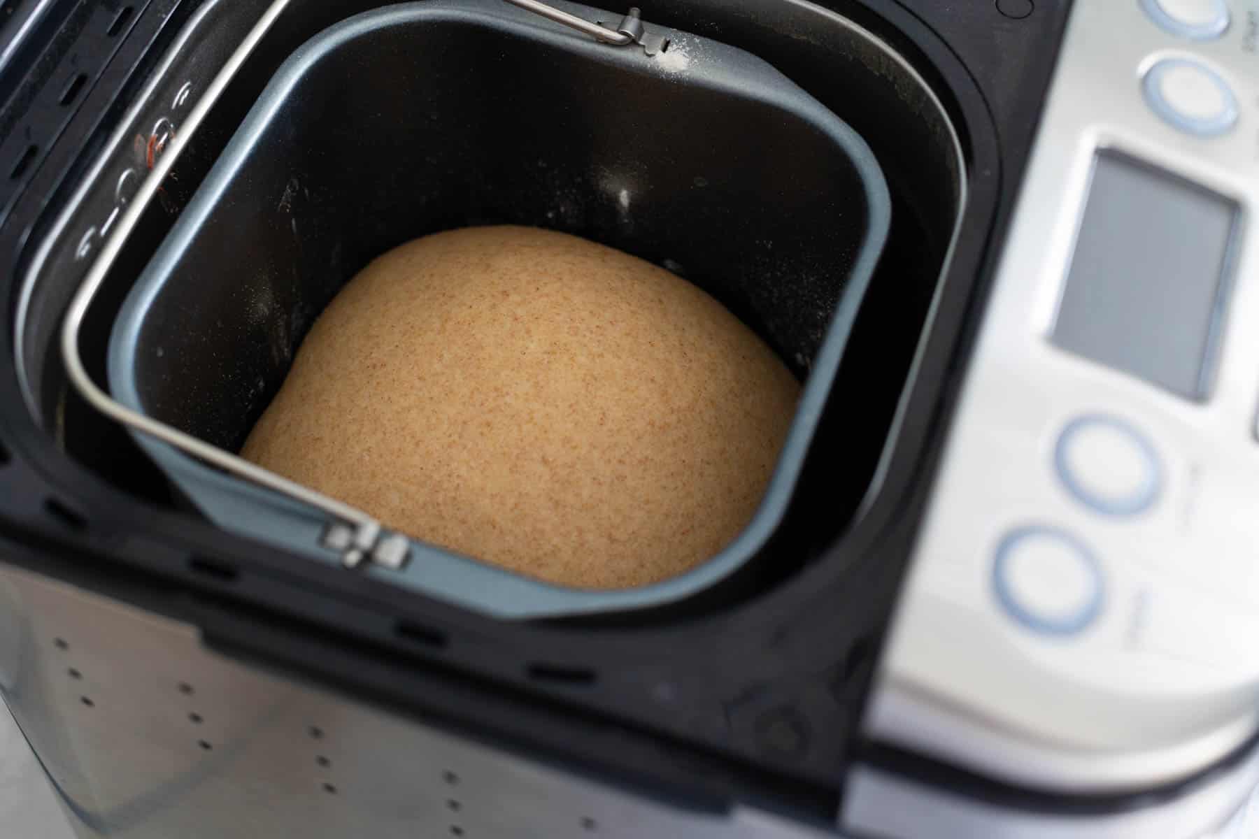 The finished dough is in the bread maker, lovely and smooth and risen.