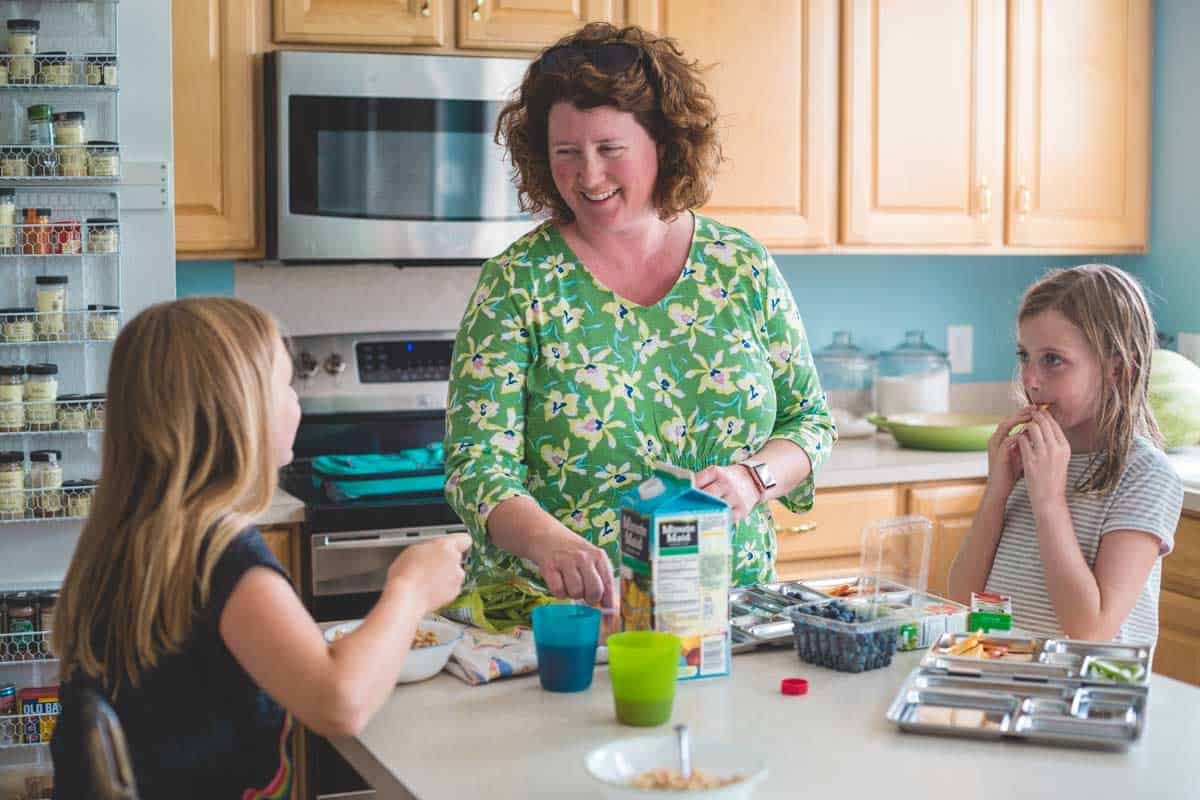 Tiffany Dahle in the kitchen with her two daughters making breakfast.