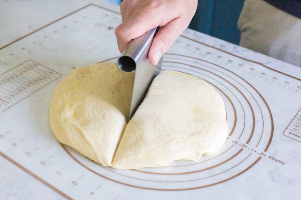 How to cut the pizza dough in half.