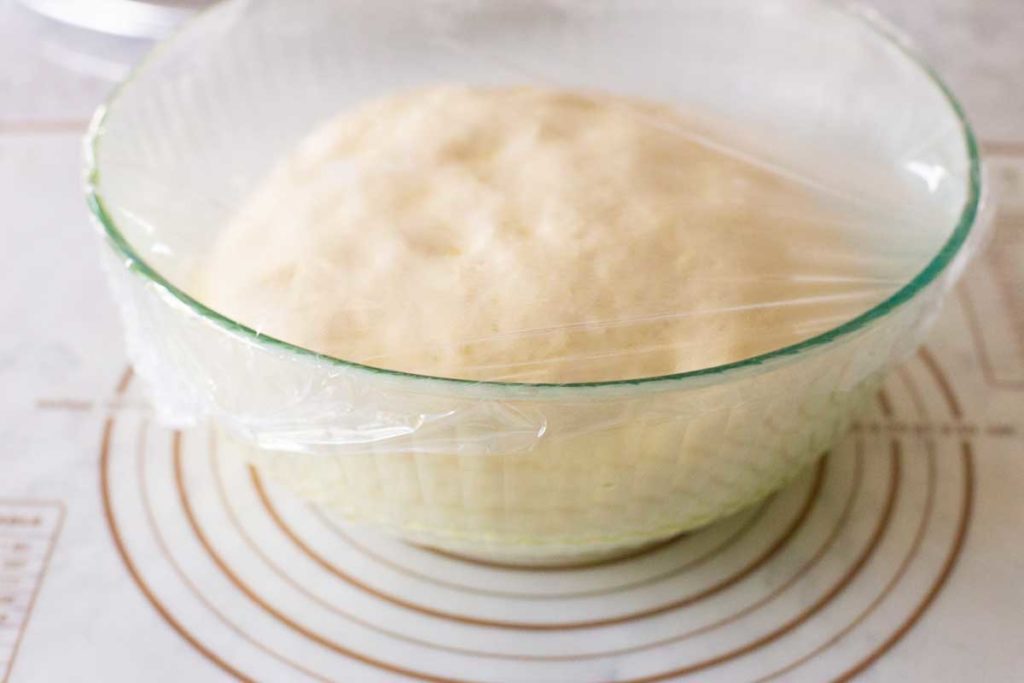 The perfect risen dough is ready for shaping into pizzas.