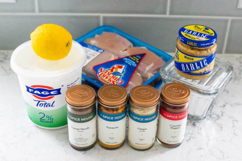 The ingredients for air fryer tandoori chicken sits on the counter.