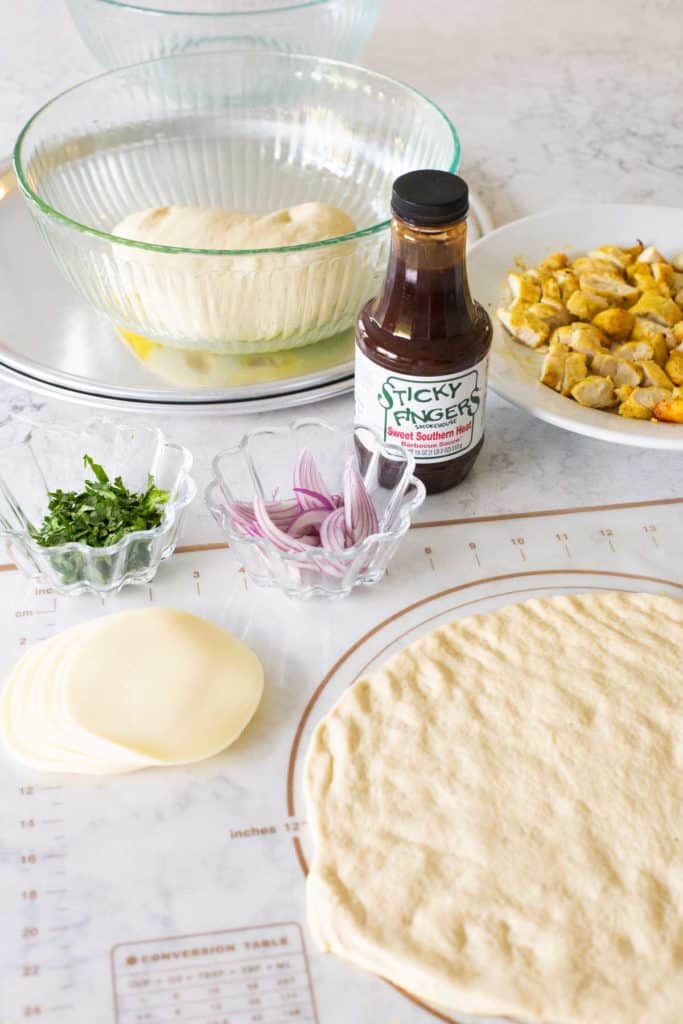 The ingredients for homemade barbecue chicken pizza.