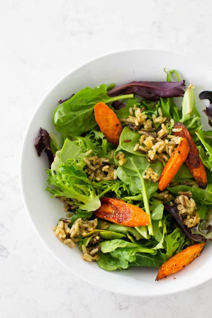 The final serving of crispy rice salad is in a white bowl.