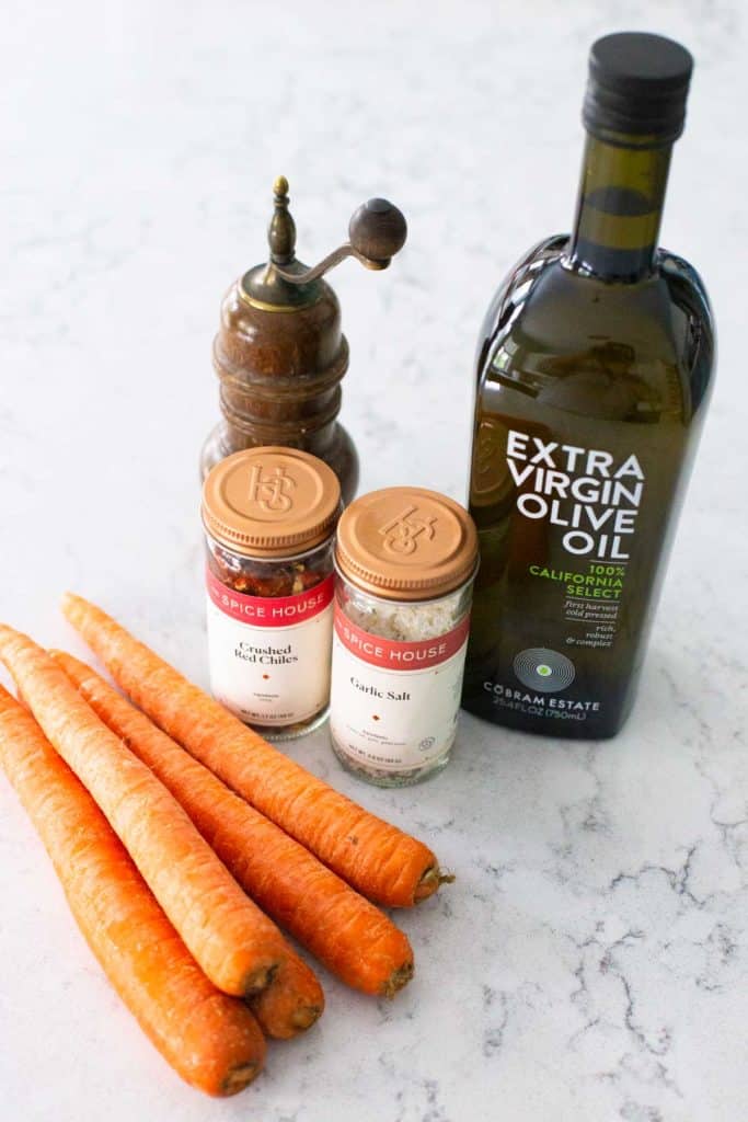 The ingredients for roasted carrots on the counter.