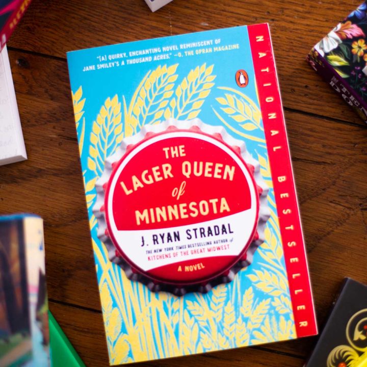 A copy of The Lager Queen of Minnesota sits on a table.