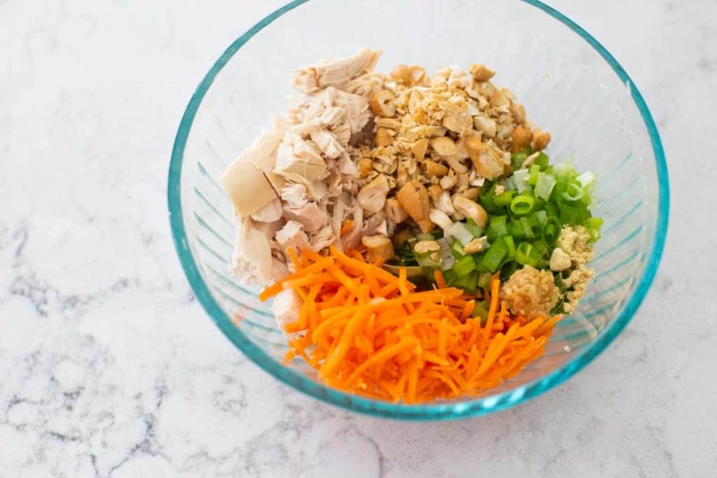 The ingredients for the chicken topping are in a mixing bowl.