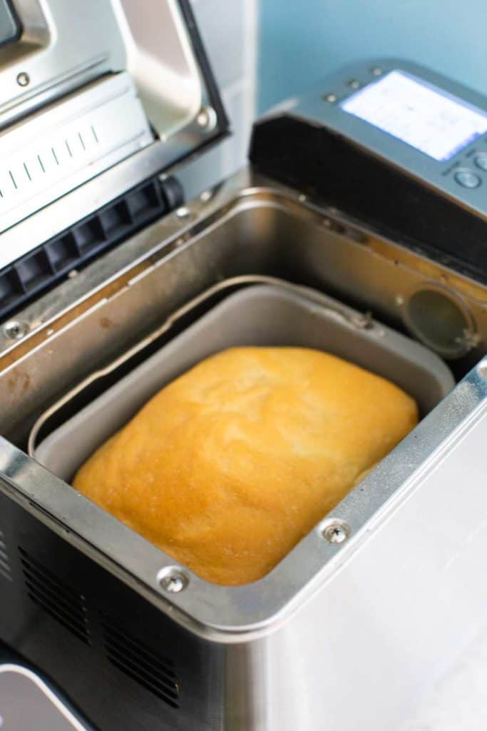 A baked loaf of bread inside the Breville bread machine.