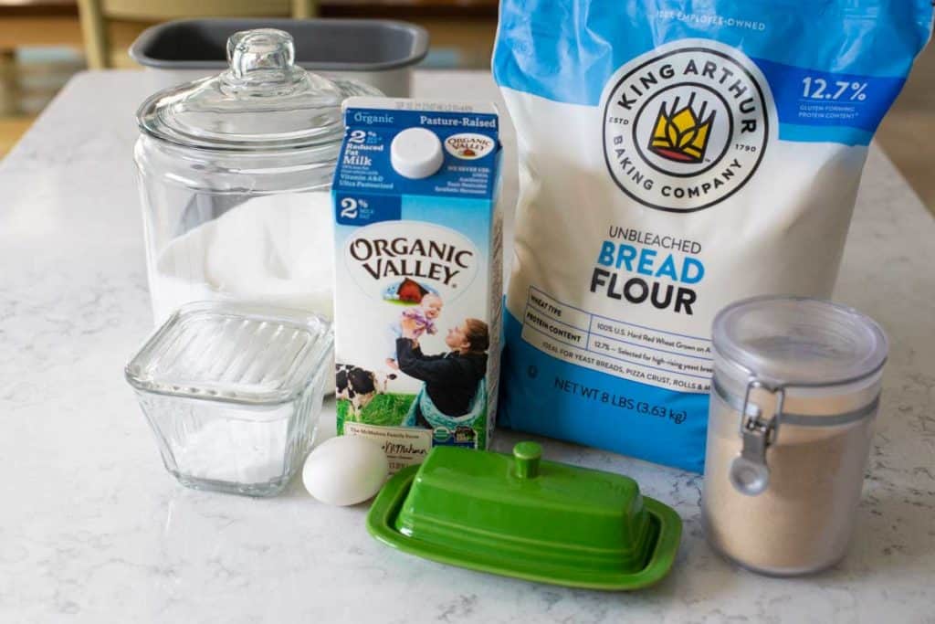 The ingredients for the Italian bread sit on a kitchen counter.