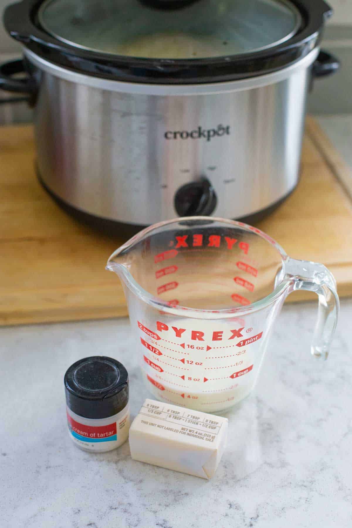 Additional ingredients for finishing the mashed potatoes sit on the counter.