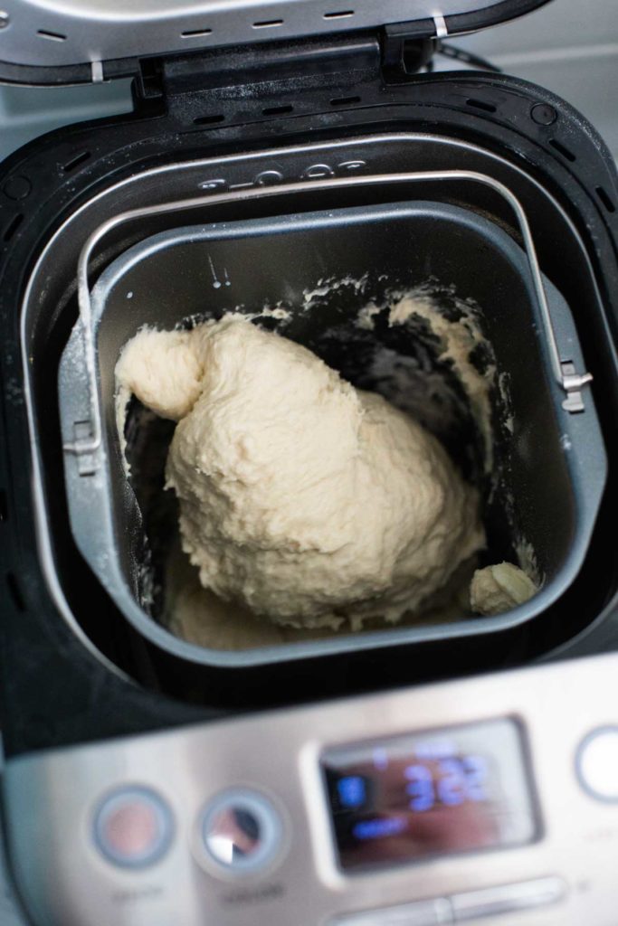 A too-wet ball of dough inside the Cuisinart bread pan.