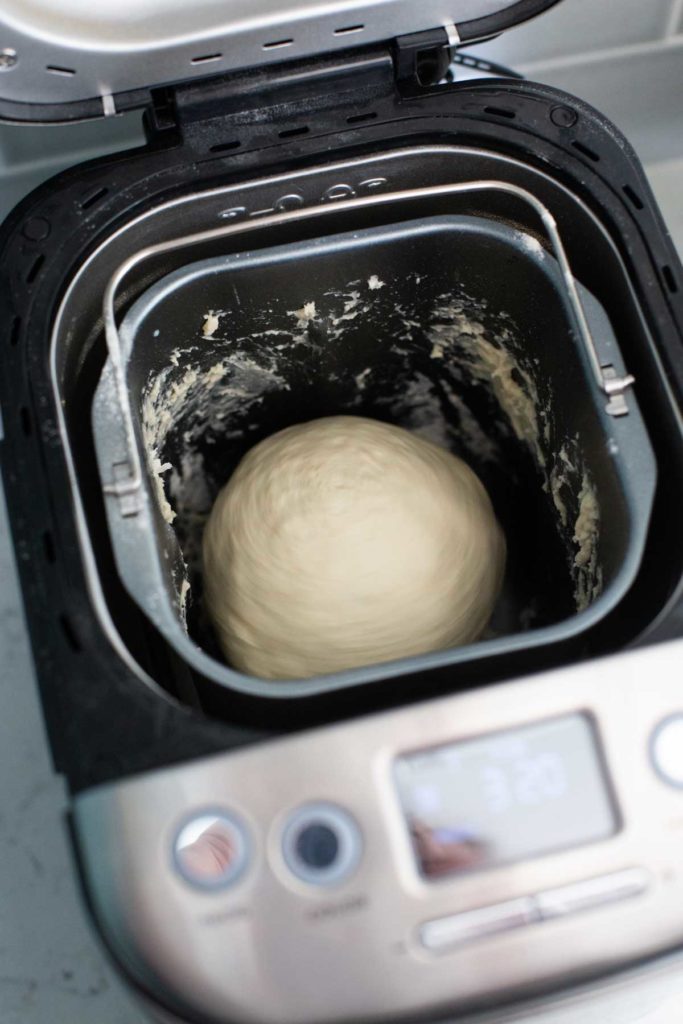 The proper dough ball inside the Cuisinart bread pan.
