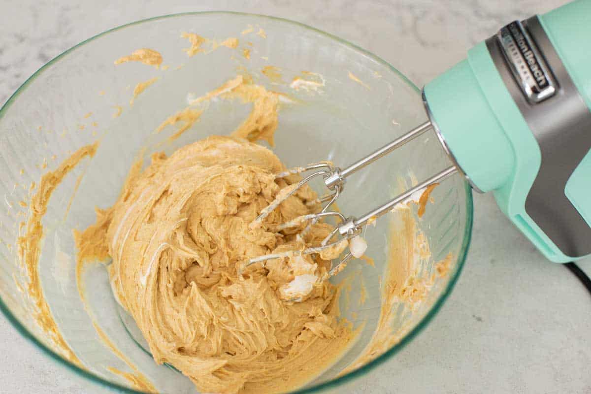 The peanut butter dip has been stirred together in the mixing bowl.