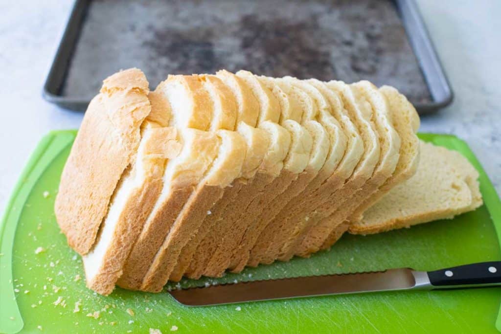 The homemade Italian bread has been sliced into thin slices.