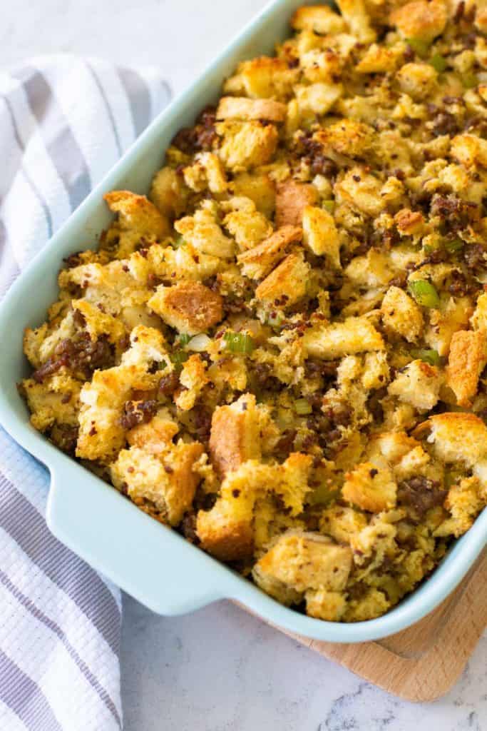 The baked Italian sausage stuffing is being presented on the counter.