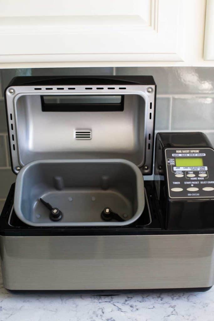 The Zojirushi bread machine has been opened underneath the cabinet.