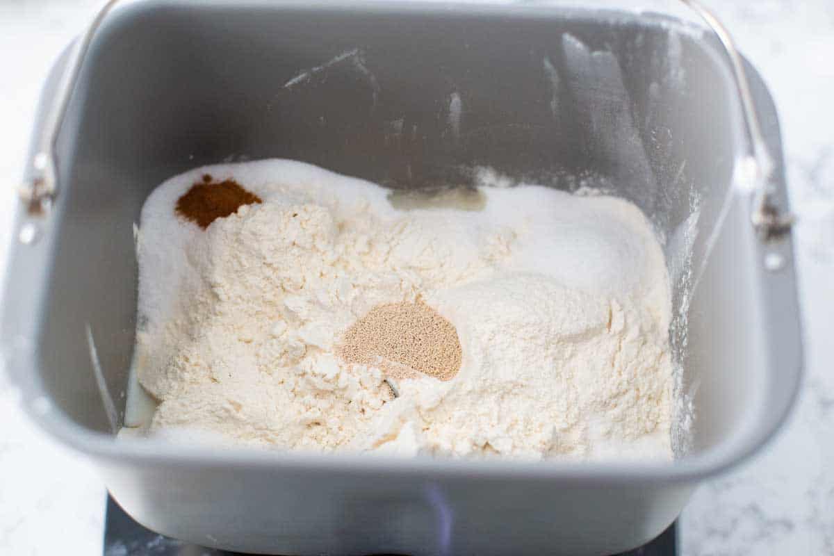 The dry ingredients for the banana bread are in the bread machine bread pan.