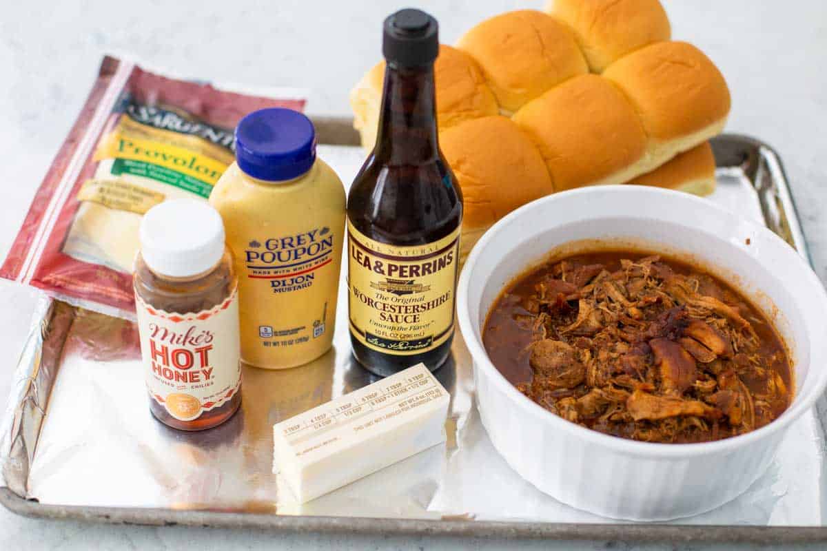 Ingredients for the BBQ chicken sliders are on a tray.