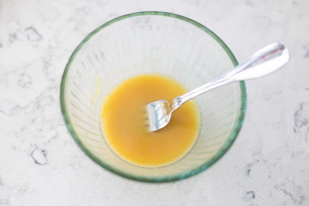 The butter sauce for the BBQ chicken sliders has a fork to mix it.