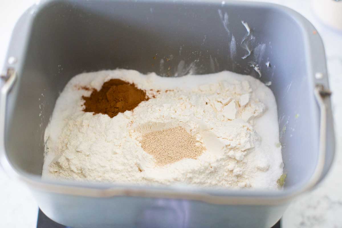 The dry ingredients for the carrot cake bread are in the bread machine bread pan.